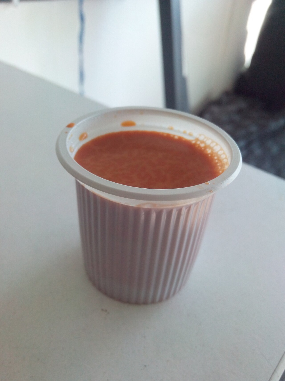 Cutting chai in a small glass, Mumbai